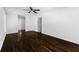 Open living room with hardwood floors, white walls, and ample natural light at 12042 Brown Bridge Rd, Covington, GA 30016