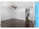 Bright living room featuring hardwood floors, white walls, and modern ceiling fan at 12042 Brown Bridge Rd, Covington, GA 30016