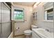 Bathroom featuring a shower-tub combo, toilet, sink, and vanity with natural light at 270 Lakemoore Dr # B, Atlanta, GA 30342