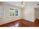 Bedroom with hardwood floors, ceiling fan, natural light, and an open closet at 270 Lakemoore Dr # B, Atlanta, GA 30342