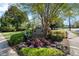 Well-maintained Lakemoore Colony sign surrounded by colorful landscaping and lush green trees at 270 Lakemoore Dr # B, Atlanta, GA 30342