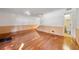 Spacious living room with beautiful hardwood floors, stairway, and a convenient half-bathroom at 270 Lakemoore Dr # B, Atlanta, GA 30342