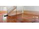 Spacious living room with beautiful hardwood floors, stairway, and large window at 270 Lakemoore Dr # B, Atlanta, GA 30342