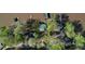 An aerial view displays a cluster of homes in a waterfront community with easy lake access at 480 Friar Tuck Cir, Covington, GA 30014