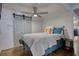 Charming bedroom featuring gray sliding closet doors, ceiling fan, and shiplap accent wall at 480 Friar Tuck Cir, Covington, GA 30014