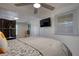 This bedroom features a ceiling fan, TV, and shiplap walls for a modern touch at 480 Friar Tuck Cir, Covington, GA 30014