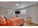 This bedroom features shiplap walls, wood floors, and two windows for lots of natural light at 480 Friar Tuck Cir, Covington, GA 30014