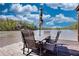 A lakeside dock is the perfect setting for an outdoor dining area with seating and stunning water views at 480 Friar Tuck Cir, Covington, GA 30014