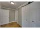 Hallway features gray and white shiplap walls and wood-look floors at 480 Friar Tuck Cir, Covington, GA 30014