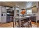 Stylish kitchen featuring stainless steel appliances, a central island and white cabinetry at 480 Friar Tuck Cir, Covington, GA 30014