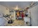 Unfinished storage room with laundry sink and mower at 480 Friar Tuck Cir, Covington, GA 30014