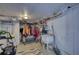 Unfinished storage room with laundry sink and mower at 480 Friar Tuck Cir, Covington, GA 30014