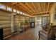 Enclosed sun room with wood-look floors and lake views at 480 Friar Tuck Cir, Covington, GA 30014