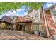 Home backyard with a view of two decks, brick siding, and landscaping at 12150 Dancliff Trce, Alpharetta, GA 30009