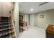Finished basement area featuring neutral carpet, fresh paint, and an entertainment area at 12150 Dancliff Trce, Alpharetta, GA 30009