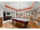 Basement featuring a pool table, seating area and bar, perfect for entertaining at 12150 Dancliff Trce, Alpharetta, GA 30009
