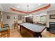 Basement recreation room featuring a pool table and a seating area, perfect for entertaining at 12150 Dancliff Trce, Alpharetta, GA 30009