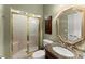Well-appointed bathroom featuring tiled shower, vanity with granite countertop, and stylish fixtures at 12150 Dancliff Trce, Alpharetta, GA 30009