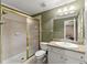 Bathroom featuring granite vanity, a shower with glass doors and access to a connecting room at 12150 Dancliff Trce, Alpharetta, GA 30009