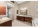 Bathroom featuring granite countertops, tile floors, a jetted tub and a separate vanity area at 12150 Dancliff Trce, Alpharetta, GA 30009