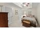 Comfortable bedroom with tray ceiling, fan, closet, and neutral walls perfect for a restful retreat at 12150 Dancliff Trce, Alpharetta, GA 30009