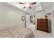 Comfortable bedroom with neutral walls, carpet flooring, closet, and ceiling fan for a peaceful sleep at 12150 Dancliff Trce, Alpharetta, GA 30009