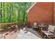 Relaxing outdoor deck with seating and a view of the lush greenery and the surrounding nature at 12150 Dancliff Trce, Alpharetta, GA 30009