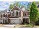 Charming brick townhome with a two-car garage and a beautifully landscaped front yard in a desirable community at 12150 Dancliff Trce, Alpharetta, GA 30009