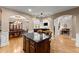 Open kitchen with an island, modern appliances, and an adjacent dining area creates a great space for cooking and gathering at 12150 Dancliff Trce, Alpharetta, GA 30009