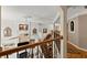 Living room with a fireplace, built-in shelves and staircase leading to upper level at 12150 Dancliff Trce, Alpharetta, GA 30009