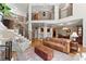 Spacious living room with high ceilings, hardwood floors, and a staircase leading to the upper level at 12150 Dancliff Trce, Alpharetta, GA 30009