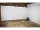 Unfinished basement with concrete floor, cinder block foundation, and exposed wooden framing ready to be completed at 1521 Larkwood Dr, Canton, GA 30114