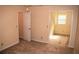 A sunny bedroom with a doorway, featuring neutral walls and carpet, providing versatile space at 1521 Larkwood Dr, Canton, GA 30114