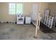 Bonus room with white appliances and ramp, offering possibilities as a kitchen or multi-purpose area at 1521 Larkwood Dr, Canton, GA 30114