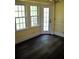 Charming breakfast nook bathed in natural light, featuring dark floors and views of the outdoors at 1521 Larkwood Dr, Canton, GA 30114