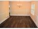 Dining room featuring hardwood floors, a chandelier, and a large window at 1521 Larkwood Dr, Canton, GA 30114