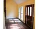 Bright living room boasting hardwood floors, natural light, and a striking front door at 1521 Larkwood Dr, Canton, GA 30114