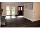 Living room featuring hardwood floors, a fireplace, and a front door at 1521 Larkwood Dr, Canton, GA 30114