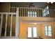 Loft area overlooking the main level, featuring a ceiling fan and a window at 1521 Larkwood Dr, Canton, GA 30114