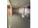 Unfinished basement featuring painted floor, white walls and support beams at 1871 Kinridge Rd, Marietta, GA 30062