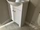 Bathroom featuring white vanity with single sink and marbled-look tile flooring at 1871 Kinridge Rd, Marietta, GA 30062