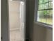 Walk-in closet with carpet flooring, white shelving and view of yard at 1871 Kinridge Rd, Marietta, GA 30062