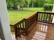Exterior deck with wood railings overlooks the fenced-in backyard and storage shed at 1871 Kinridge Rd, Marietta, GA 30062