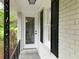 Up close view of the front door and side window with black shutters at 1871 Kinridge Rd, Marietta, GA 30062