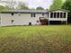 Back of the house showing the back yard and screened in porch at 1871 Kinridge Rd, Marietta, GA 30062