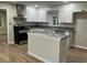 Updated kitchen with white cabinets, stainless steel appliances, and a central island at 1871 Kinridge Rd, Marietta, GA 30062