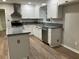 Bright kitchen features white cabinets, granite countertops and stainless steel appliances at 1871 Kinridge Rd, Marietta, GA 30062