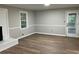 Spacious living area with wood floors, fireplace, and access to an outdoor patio at 1871 Kinridge Rd, Marietta, GA 30062