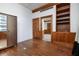 Spacious bedroom featuring hardwood floors, built-in shelving, and traditional wood trim at 20 Marietta St # 4B, Atlanta, GA 30303