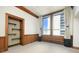 Bright bedroom with soft carpet, large windows with curtains, and trim at 20 Marietta St # 4B, Atlanta, GA 30303